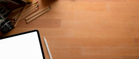 Side view of female workers consulting on their work with smartphone and laptop in minimal office roomの写真素材