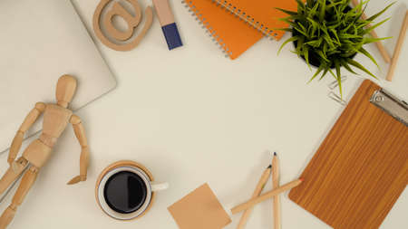Top view of mock up scene creator with stationery, supplies, laptop, decorations and copy space on...