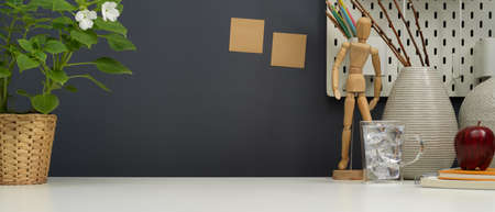 Close-up view of modern designer workspace with office supplies, decorations and copy spaceの写真素材