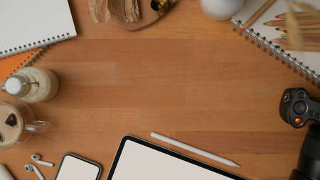 Top view of mock up scene creator with mock up digital devices, supplies, stationery and copy space...
