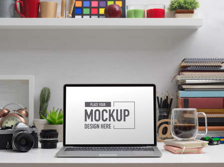 Close up view of mock up laptop on study table with school elements and decorations
