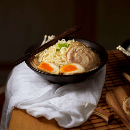Cropped shot of Tonkotsu ramen, traditional Japan noodle with sliced pork and eggs and pork bone based soupの写真素材