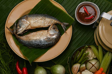 Top view of fried mackerels with shrimp paste sauce and vegetable set served on Thai traditional plateの写真素材