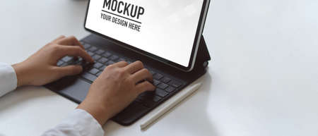 Cropped shot of female working with digital tablet include clipping path in co working space