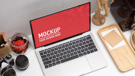 Top view of mock up laptop on study table with school elements and decorationsの写真素材