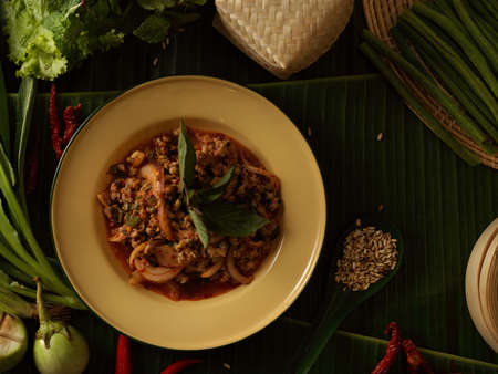 Top view of spicy minced pork salad (Larb Moo), Thai traditional food served with vegetablesの写真素材