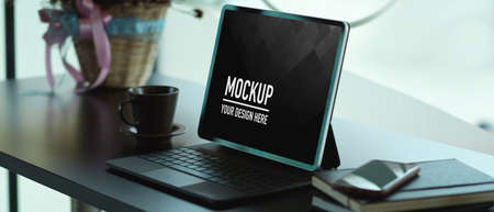 Close up view of portable workspace  digital tablet and supplies on the table, include
