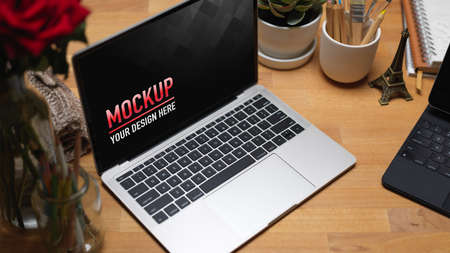 Cropped shot of workspace  laptop, coffee mug and supplies in-home office roomの写真素材