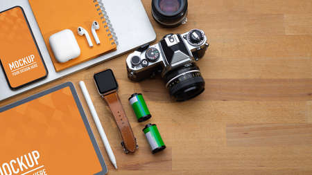 Top view of workspace with digital devices, camera, accessories and copy space, include clipping...