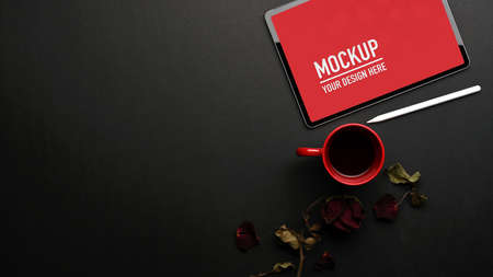 Top view of workspace with tablet, coffee cup, copy space and flower decorated on the table, clipping pathの写真素材