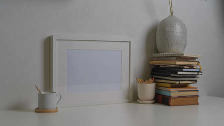 Cropped shot of workspace with tablet, laptop, books and decorations in home office room, clipping...