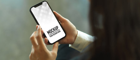 Top view of female hands using smartphone, include clipping pathの写真素材