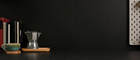 Close view of workspace with coffee pot, books and copy space in home office roomの写真素材