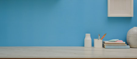 Close up view of study table with stationery, decorations and copy space in home office roomの写真素材