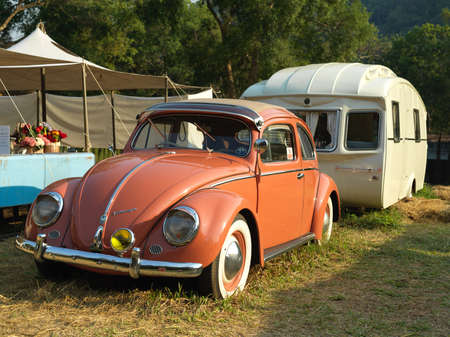 CHIANG MAI, THAILAND - FEBRUARY 17, 2021 : Orange 1969 Volkswagen Beetle parked in camping groundのeditorial素材