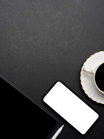 Top view of dark creative flat lay workspace with smartphone, tablet, coffee cup and copy space,...
