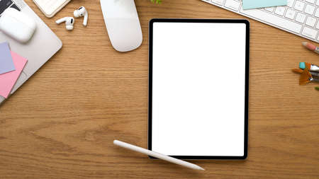 Top view of workspace with digital tablet include clipping path, accessories and stationery on...