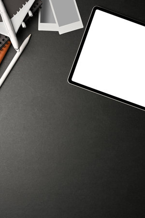Creative flat lay workspace with digital tablet, decorations and copy space on black table, clipping pathの写真素材
