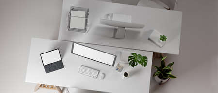3D rendering, interior office design with two office desk opposite each other with computer devices and office supplies, 3D illustration, top viewの写真素材