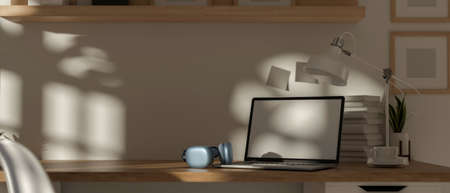 3D rendering, portable workspace with laptop, headphone, cup, lamp, stack of books and copy space on...
