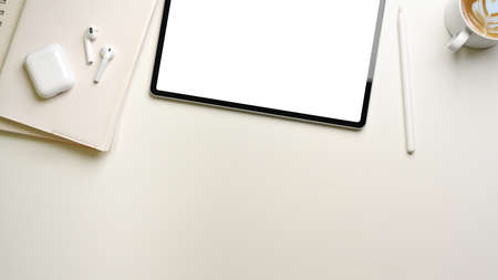 Creative flat lay workspace with digital tablet, notebooks, accessories and copy space, top viewの写真素材