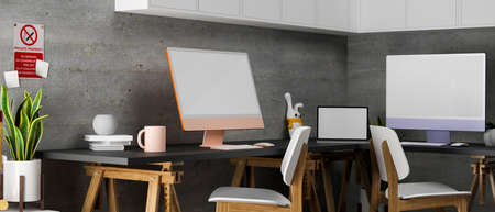 3D rendering, modern loft co-working space with computer devices, laptop, supplies, doll and plant pot decorated in the room, 3D illustrationの写真素材