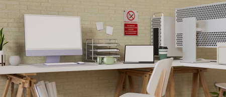 Comfortable office desk with computer, laptop, office supplies, decorations and no smoking sign on the wall, 3D rendering, 3D illustrationの写真素材