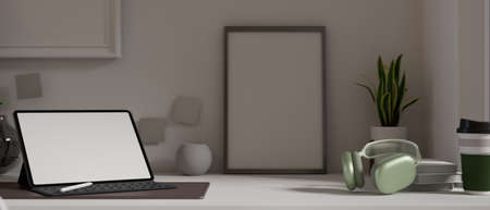 Portable workspace with digital tablet and accessories on the table in living room with decorations in the back, 3D rendering, 3D illustrationの写真素材