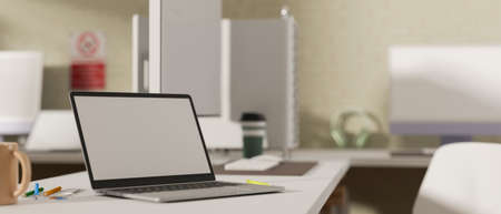Side view, 3D rendering, portable workspace in office room with laptop and office supplies on the table, 3D illustrationの写真素材