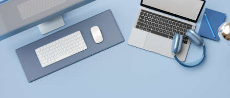Top view, 3D rendering, flat lay trendy workspace with computer, laptop, accessories, stationery and copy space on pastel blue background, 3D illustrationの写真素材