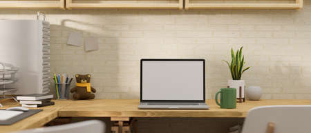 3D rendering, laptop with mock-up screen on wooden table with supplies and plant pot decorated in the room, 3D illustrationの写真素材