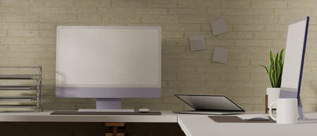 3D rendering, computers and laptop with mock-up screen on office desk with supplies and decorations, 3D illustrationの写真素材