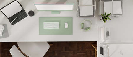 3D rendering, top view of office workspace with computer, digital tablet and office supplies on the table, 3D illustrationの写真素材