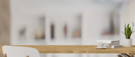3D rendering, books, cup and plant pot on a wooden table with white chair in blurred background, 3D illustrationの写真素材