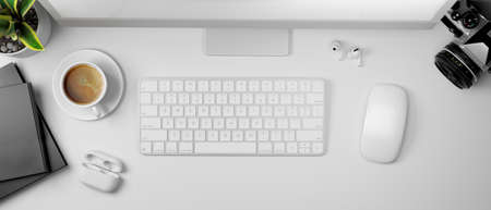 3D rendering, white computer table with coffee cup, camera and supplies, top view, 3D illustrationの写真素材