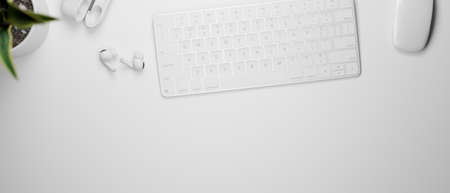 3D rendering, top view of white working space with computer keyboard, mouse and earphone, 3D illustrationの写真素材