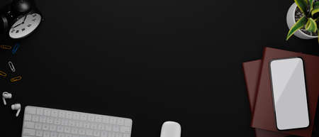 3D rendering, top view of dark working space with smartphone, computer accessories, books and copy space, 3D illustrationの写真素材