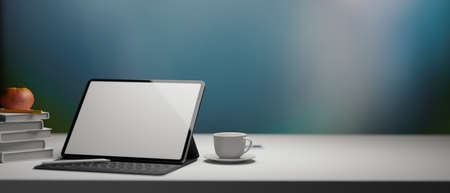 3D rendering, digital tablet with mock-up screen and keyboard on white table with cup, books and apple, 3D illustrationの写真素材