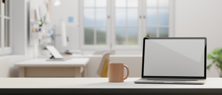 Laptop with mock-up screen and coffee mug on the table in comfortable office room, 3D rendering, 3D illustrationの写真素材