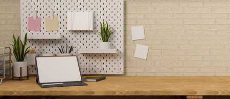 Digital tablet with mock-up screen and keyboard on wooden table with stationery and decorations, 3D rendering, 3D illustrationの写真素材