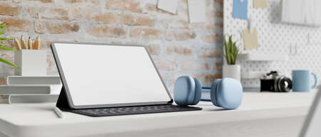 Digital tablet with mock-up screen and accessories in contemporary working space, 3D rendering, 3D illustrationの写真素材