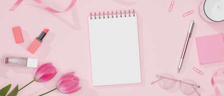 Feminine workspace with stationery, eyeglasses, cosmetics and decorations on pink table, 3D rendering, 3D illustrationの写真素材