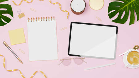 Feminine workspace with digital tablet, notebook, decorations and coffee cup on pink background, 3D rendering, 3D illustrationの写真素材