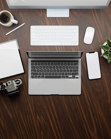 Top view of working space with laptop, computer, tablet smartphone and supplies on wooden table, 3D rendering, 3D illustrationの写真素材