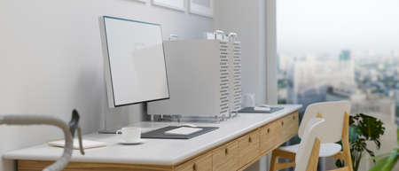 Side view of computer device on the desk beside panoramic window in apartment, 3D rendering, 3D illustrationの写真素材