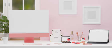 Computer device and digital tablet with mock-up screen on the table in pink wall room, 3D rendering, 3D illustrationの写真素材