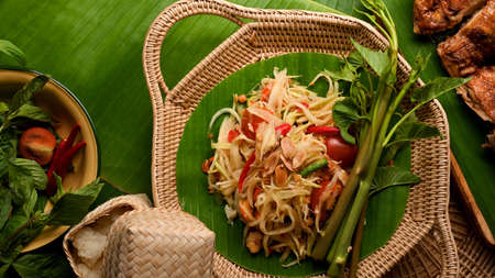 Papaya salad (Somtum) serving with Thai style grilled chicken and sticky rice, Thai tradition foodの写真素材