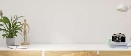 Minimal workspace with copy space on the desk with camera, books, stationery and decorations, 3D rendering, 3D illustrationの写真素材