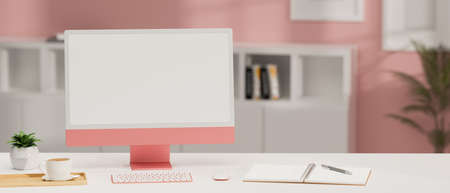 Pink computer monitor on the desk with stationery in pink office room, 3D rendering, 3D illustrationの写真素材