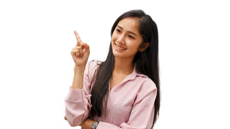 Portrait of young female gesturing and showing index finger isolated in white backgroundの写真素材